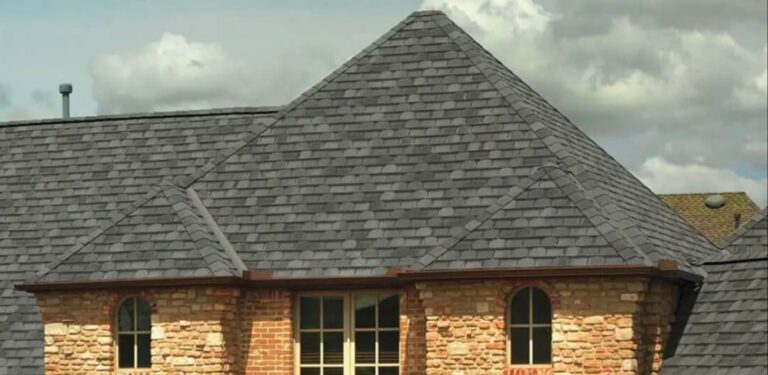 A house with a newly replaced asphalt shingle roof.