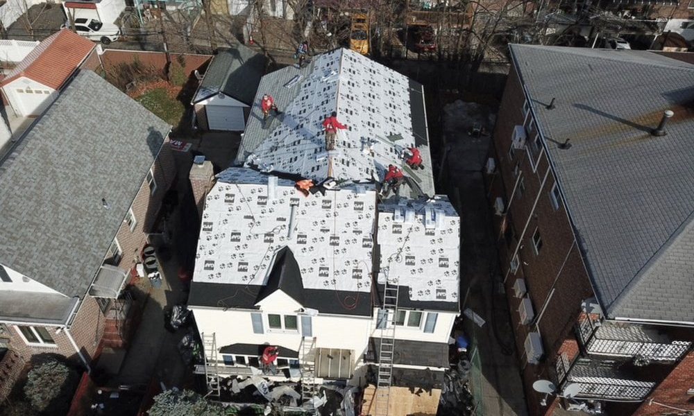 ProLine Roofing's crew replacing a roof in Staten Island. Drone shot